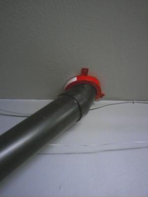 Exit from garage into attic then out threw roof. 30 in. from roof peak 