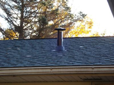 Vent through roof with storm cap