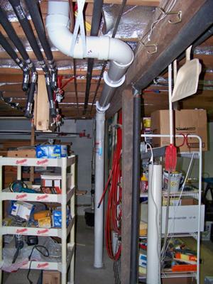 Manometer reads constant .45 w.c.  Well sealed sump basin in background.