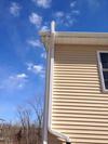 3x4 downspout installed next to roof gutter system.